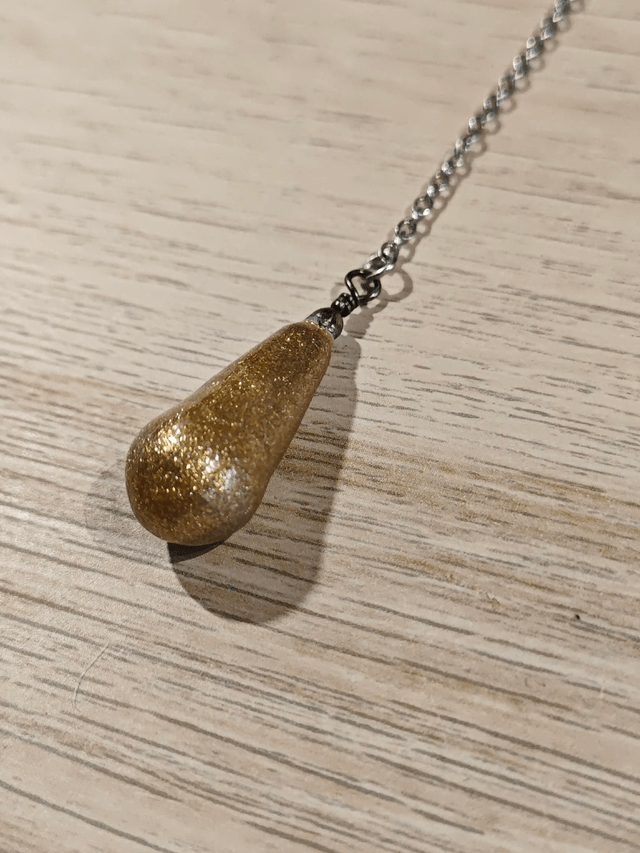 Pendule "goutte" - doré